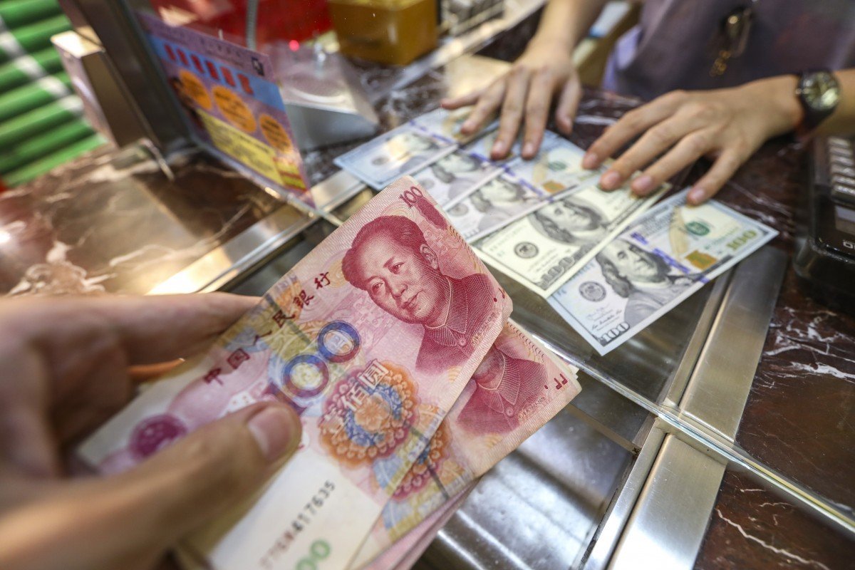 China’s cut of US dollar weighting in key index will boost global fortunes of yuan, economists say