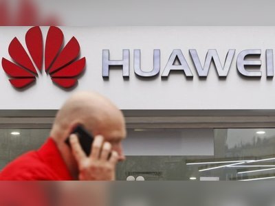 Huawei: Government wins vote after backbench rebellion