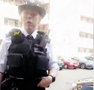 Met Police accused of racism as officer handcuffs black ambulance ...