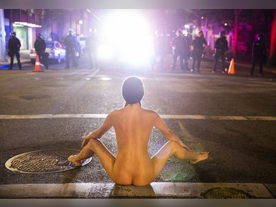 The story behind the surreal photos of Portland protester ‘Naked Athena’
