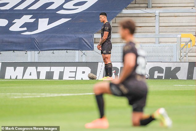 Controversial rugby star Israel Folau, who was sacked by Australia for saying 'hell awaits' gay people, REFUSES to take a knee before Catalans Dragons' Super League defeat at St Helens - and is the ONLY player to do so