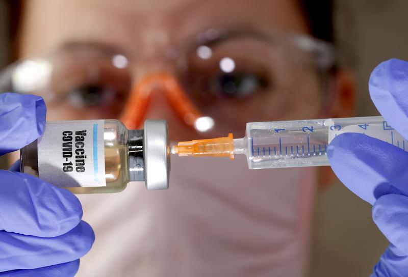 Britain changes vaccine rollout measures for COVID and flu