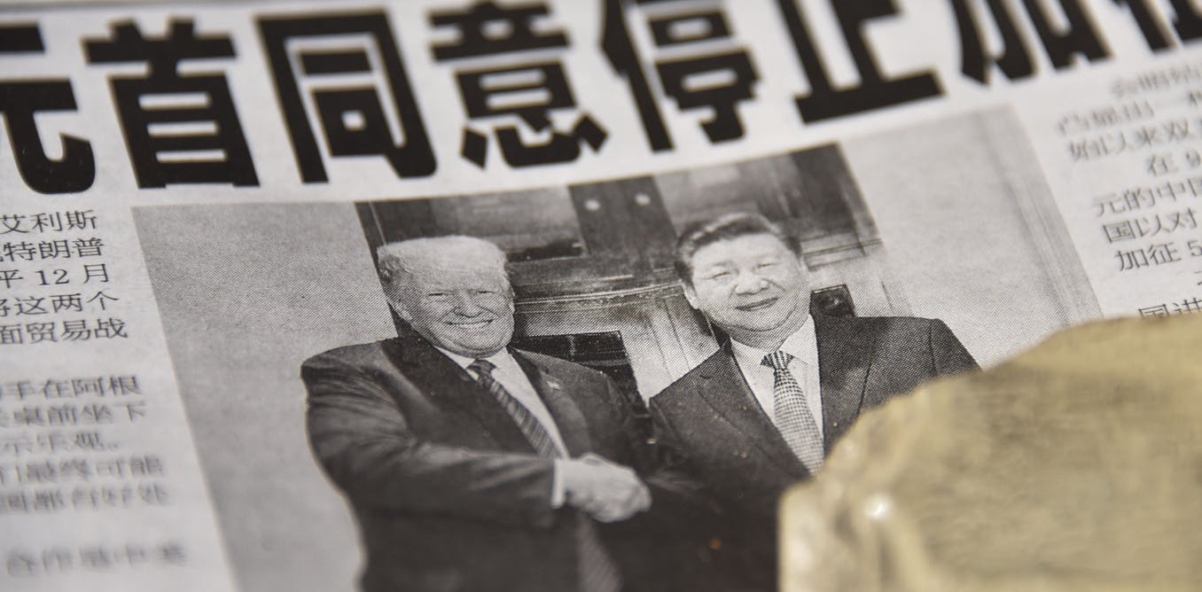 A Chinese newspaper features a front page photograph ofU.S. President Donald Trump shaking hands with Chinese President Xi Jinping.