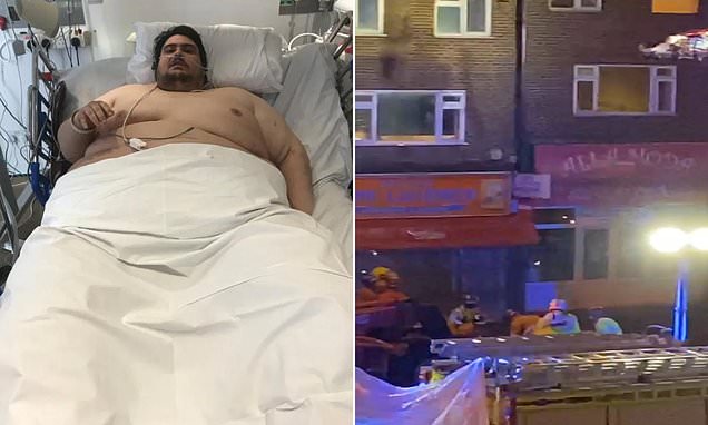 Britain's 50-stone fattest man is hoisted out of his flat by CRANE