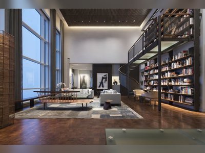 Inside a chic, industrial-inspired penthouse loft with skyline views