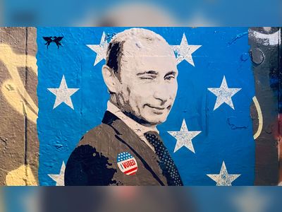 Winking Putin Gets 'I Voted' Sticker In Election Day Street Art