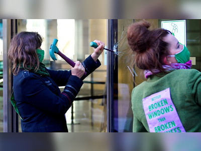 Extinction Rebellion activists arrested outside Barclays London HQ after breaking windows to protest bank’s fossil fuel financing