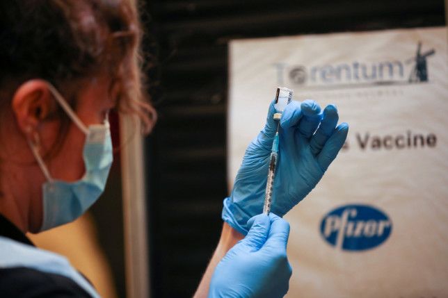 Government denies top doctor's claims UK is low on Pfizer vaccines