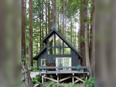 This Pristine A-Frame Cabin Glows Like a Lantern in a Redwood Forest