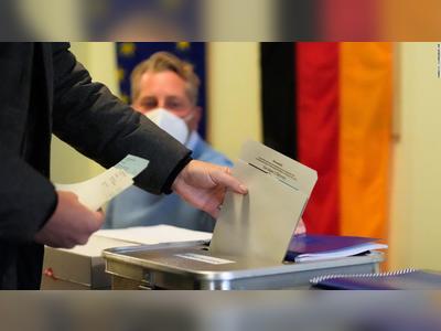 SPD narrowly ahead in exit polls for Germany's landmark election but final result uncertain