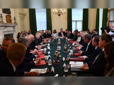 Johnson’s revamped cabinet cram into office – with no masks