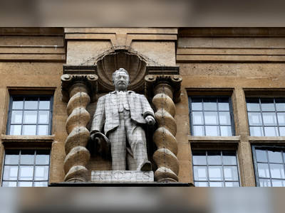 Oxford university new plaque at condemned Rhodes statue describes mogul as 'committed colonialist' & exploiter of Africans