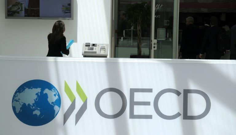 OECD hails 'major victory' as global tax holdouts join reform