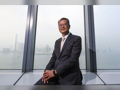 Hong Kong finance chief tight-lipped on top job ambitions, urges ‘healing as family’