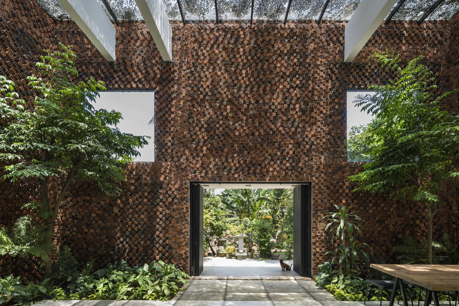 A Biophilic Home in Vietnam Impresses With a Hollow-Brick “Breathing Wall”