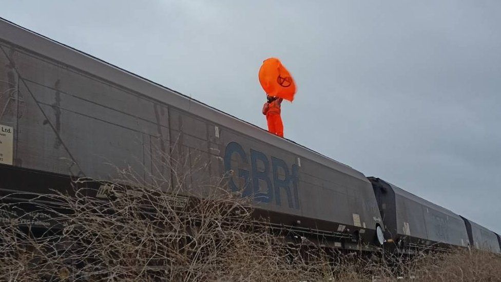 Protester climbs on top of train to Drax power station