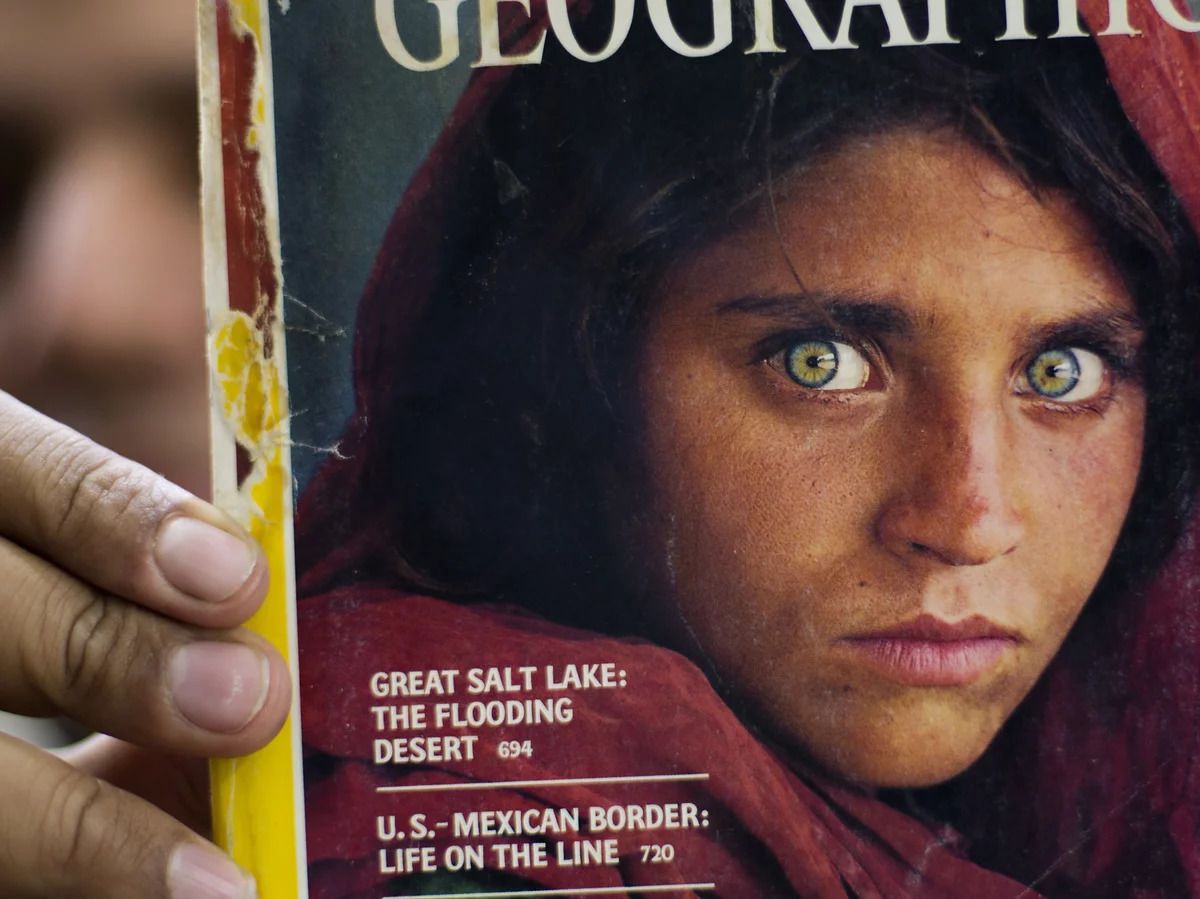 The woman from National Geographic's famous 'Afghan Girl' photo is evacuated to Italy