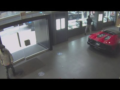 See It! Moment man smashes glass case at Chicago Lamborghini showroom, runs out with $1 MILLION in watches