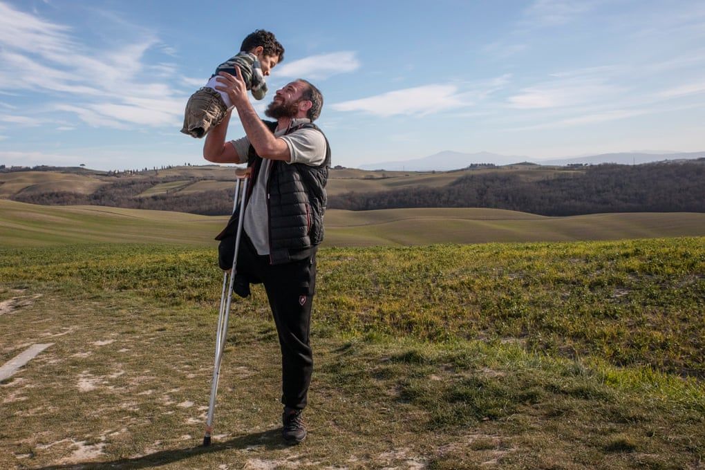 Flying high: how a photo of a Syrian father and son led to a new life in Italy