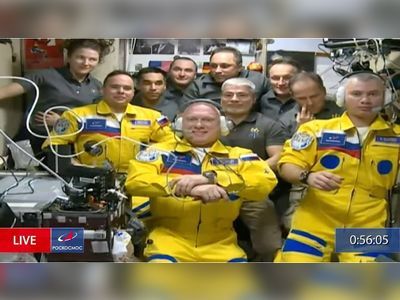 Russia denies cosmonauts board space station in Ukrainian colours