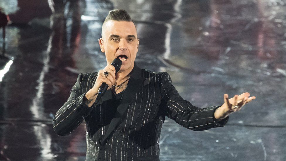 Robbie Williams: Fame 'intoxicating but isolating'