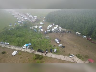 Several hundred remain at illegal rave site in Cornwall