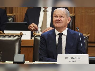 German chancellor forced again to deny link to banking tax scandal