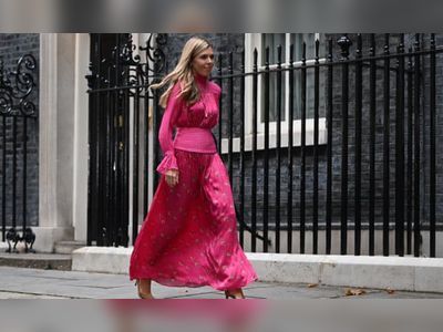 Demand for Carrie Johnson’s backless fuchsia dress crashes designer’s website