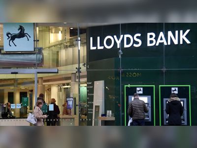 UK's Lloyds braces for housing crunch, bad loans as profit slides