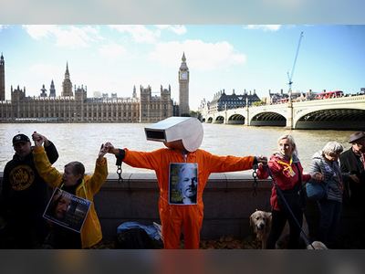 In Pics: Julian Assange Supporters Form Human Chain Outside UK Parliament