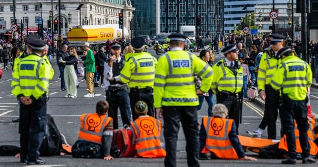 More than 50 eco-protesters arrested after Westminster brought to standstill