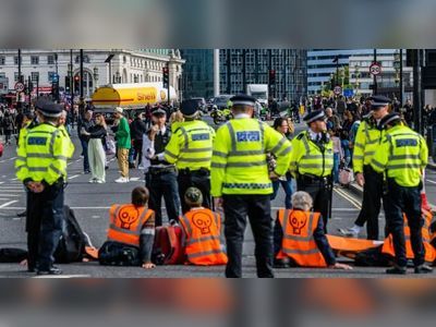 More than 50 eco-protesters arrested after Westminster brought to standstill