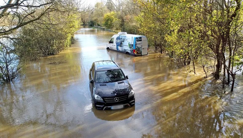UK weather: Rain warnings as flooding hits roads and rail
