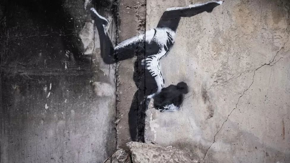 Banksy unveils Ukraine gymnast mural on building shelled by Russia