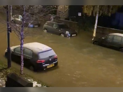 Burst water mains flood residential road in Camden