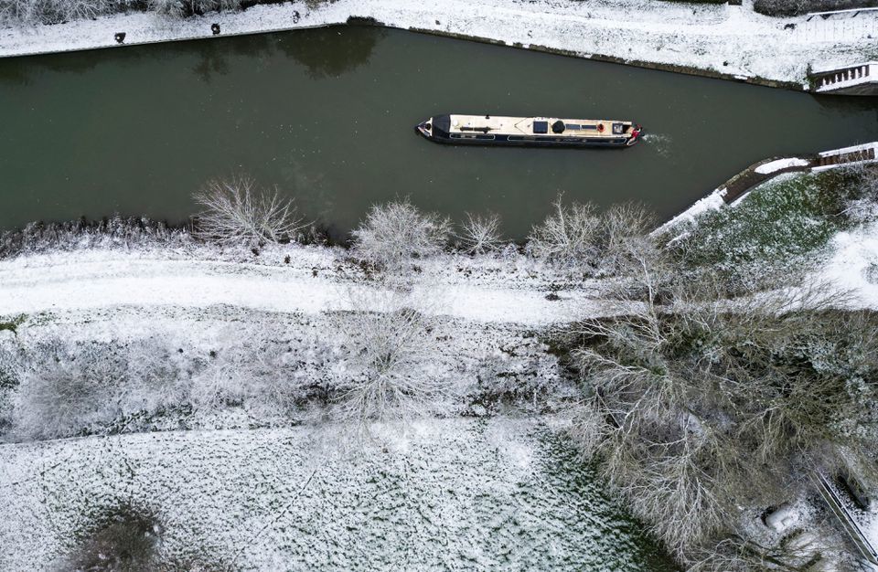 Heavy snow disrupts UK travel; three boys die after falling into lake