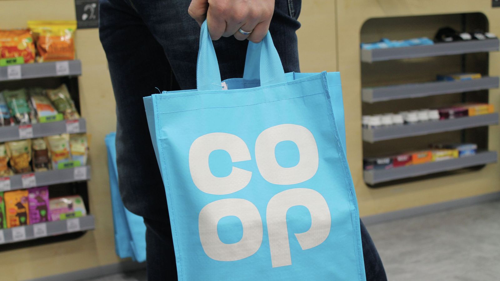 Co-op reports full-year profit after cost-cutting and sale of petrol forecourt business to Asda