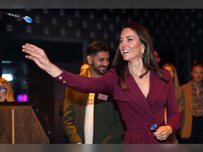 William takes restaurant booking and Kate tries darts during visit to city