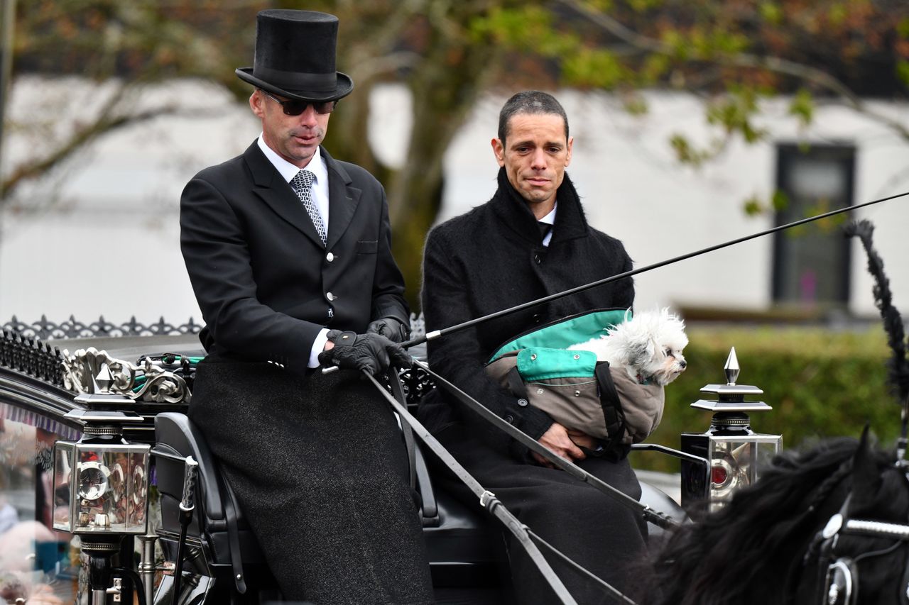 Paul O'Grady: Stars, fans and dogs turn out to say farewell at funeral