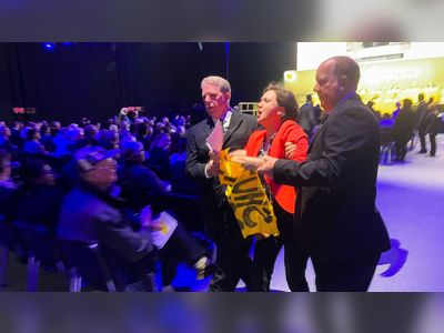 Climate change protesters try to storm stage at Shell AGM
