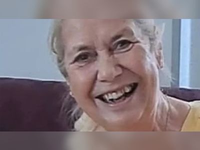 Woman hit by royal police escort motorbike dies