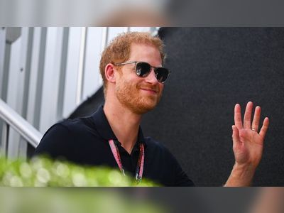 Prince Harry all smiles as he steps out at US Grand Prix without Meghan Markle