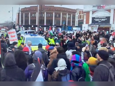 Pro-Palestine Activists Halt Police Van During Brixton March, Resulting in Two Arrests