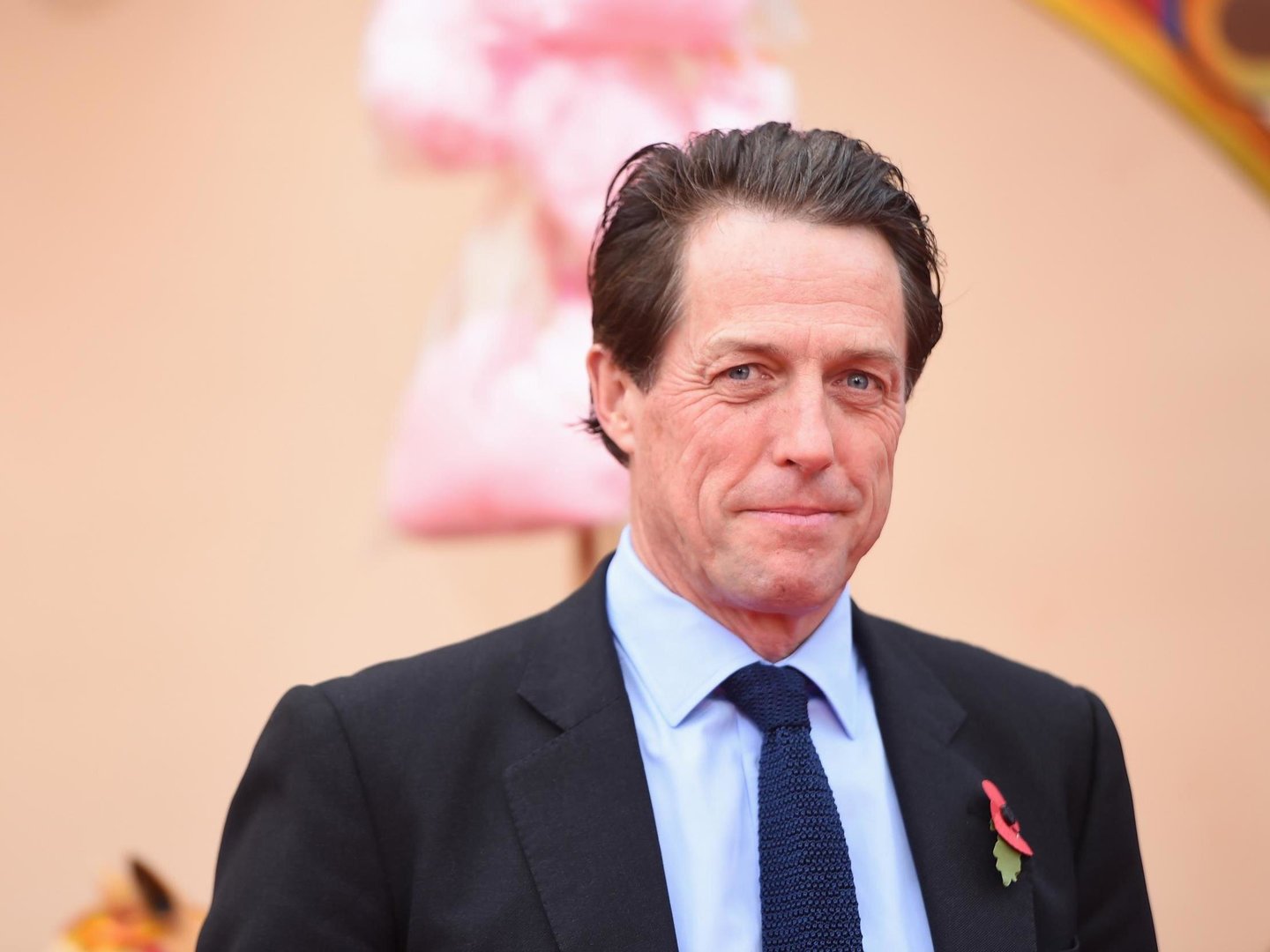 Heartwarming Surprise Hugh Grant Serves Christmas Lunch to Elderly